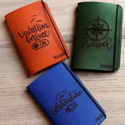 Personalized brown full-grain leather passport cover with laser engraved Vacation Mode On design, elastic band closure, and custom name Nicole engraved at bottom corner.